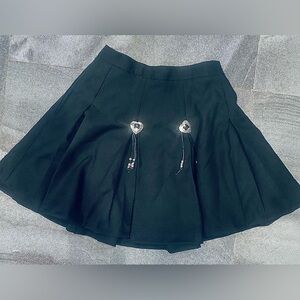Black Pleated Mini Skirt with Metal Heart Accents